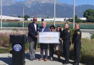 CA Assemblymember Chris Holden presents check to Mayor L. Dennis Michael