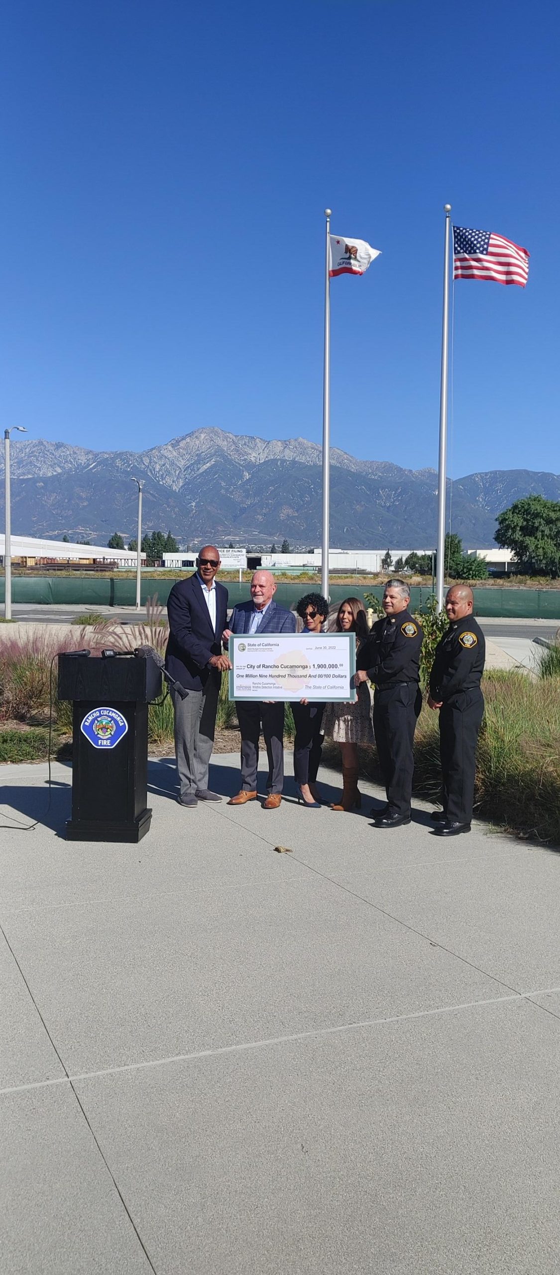 CA Assemblymember Chris Holden presents check to Mayor L. Dennis Michael